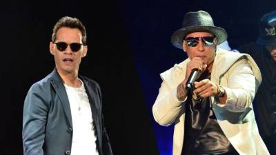 Los cantantes Marc Anthony y Daddy Yankee.