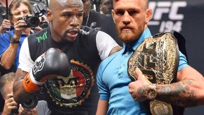El pugilista Floyd Mayweather (i) respondió el ataque verbal del luchador de la UFC, Conor McGregor.