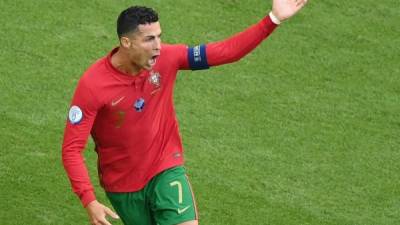 Portugal's forward Cristiano Ronaldo celebrates scoring their first goal during the UEFA EURO 2020 Group F football match between Portugal and Germany at Allianz Arena in Munich on June 19, 2021. (Photo by Matthias Hangst / POOL / AFP)