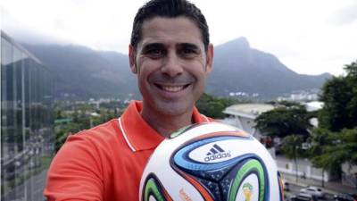 Spanish soccer star Fernando Hierro and former captain of Real Madrid holds his new shirt of the Qatari Al-Rayan club after signing with the club in Doha 28 August 2003. AFP PHOTO/Karim JAAFAR (Photo credit should read KARIM JAAFAR/AFP/Getty Images)