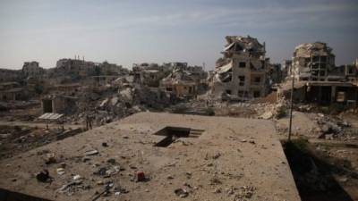 Damaged buildings are seen in the al-Rashedin area west of Aleppo in northwestern Syria, on November 20, 2018. (Photo by Aaref WATAD / AFP)