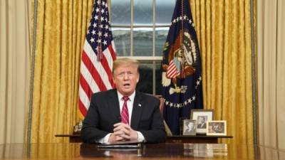 US President Donald Trump speaks as he arrives at the White House in Washington, DC, on January 19, 2019, after flying to Dover Air Force Base to visit with families of fallen soldiers. (Photo by Jim WATSON / AFP)