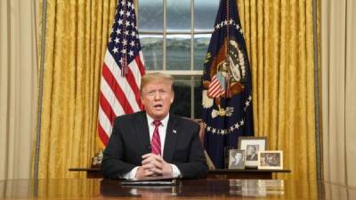 US President Donald Trump speaks as he arrives at the White House in Washington, DC, on January 19, 2019, after flying to Dover Air Force Base to visit with families of fallen soldiers. (Photo by Jim WATSON / AFP)