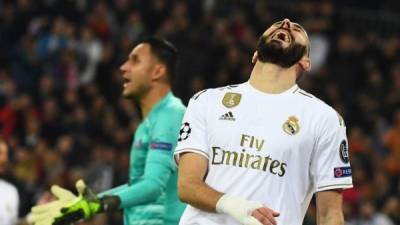 El delantero francés Karim Benzema fue la figura al marcar un doblete, pero no le ajustó ya que sufrió un empate sobre la recta final del juego. Foto AFP.