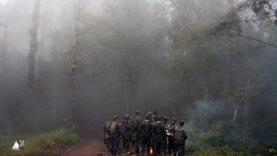 Un equipo de medicina forense del Ministerio Público y decenas de militares y policías trabajan en el sitio del accidente de un helicóptero de la Fuerza Aérea Hondureña en las cercanías de Tegucigalpa que dejó seis muertos, entre ellos Hilda Hernández, hermana del presidente Juan Orlando Hernández.