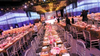 Tables and decoration are set up for the annual Rose Ball at the Monte-Carlo Sporting Club in Monaco, on March 27, 2010. The Rose Ball is one of the major charity events in Monaco. Created in 1954, it benefits the Princess Grace Foundation. AFP PHOTO VALERY HACHE