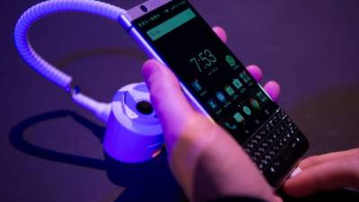 The new BlackBerry Key One is displayed at the Mobile World Congress centre in Barcelona on February 25, 2017, before the start of the world's biggest mobile fair, held from February 22 to February 25. / AFP PHOTO / Josep Lago