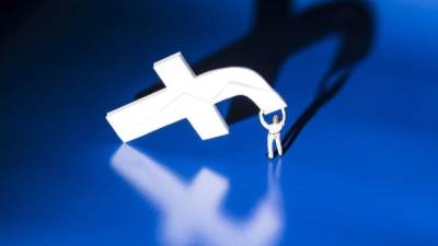 (FILES) This file photo taken on May 16, 2018 shows a figurine carrying the logo of social network Facebook in Paris. - Facebook on October 11, 2018 said it shut down 251 accounts for breaking rules against spam and coordinated deceit, some of it by ad farms pretending to be forums for political debate. The move came as the leading social network strives to prevent the platform from being used to sow division and spread misinformation ahead of US elections in November. (Photo by JOEL SAGET / AFP)