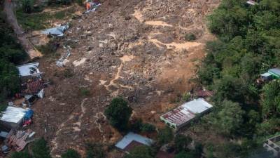 TOPSHOT - Aerial view of a mudslide where it is estimated that dozens of people died last Thursday, caused by the passage of Hurricane Eta, in the village of Queja, in San Cristobal Verapaz, Guatemala on November 7, 2020. - About 150 people have died or remain unaccounted for in Guatemala due to mudslides caused by powerful storm Eta, which devastated an indigenous village in the country's north, President Alejandro Giammattei said Friday. (Photo by Esteban BIBA / POOL / AFP)