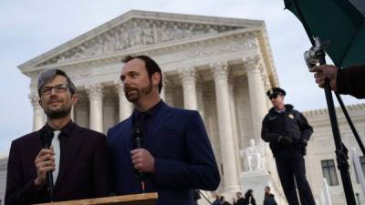 WASHINGTON, DC - DECEMBER 05: Charlie Craig (R) and Dave Mullins (L), the gay couple who were denied their wedding cake baked by cake artist Jack Phillips, wait for an interview with CNN in front of the U.S. Supreme Court December 5, 2017 in Washington, DC. The Supreme Court heard oral arguments in the Masterpiece Cakeshop v. Colorado Civil Rights Commission case. Alex Wong/Getty Images/AFP