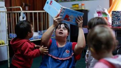 Noelia Garella es una profesora de guardería que nacen con síndrome de Down. AFP
