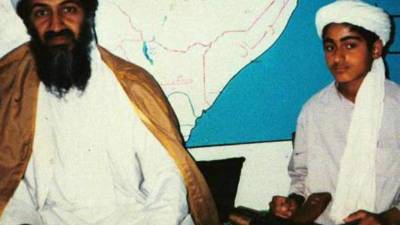 (FILES) In this file photograph taken on May 3, 2011, a Pakistani man reads a newspaper with the front page displaying news of the death of Osama bin Laden at a stall in Lahore. - Almost every day, children play cricket in a patch of scorched grass and scattered rubble in Abbottabad -- all that remains of the final lair of the most wanted person on the planet. It was in this Pakistani city that Osama bin Laden was killed in the clandestine 'Operation Geronimo' raid by US Navy Seals in the early hours of May 2, 2011. The operation had global repercussions and dented Pakistan's international reputation -- exposing contradictions in a country that had long served as a rear base for Al Qaeda and its Taliban allies while suffering from the effects of terrorism. (Photo by Arif ALI / AFP)