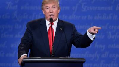 (FILES) In this file photo taken on October 19, 2016 US Republican presidential candidate Donald Trump speaks during the final presidential debate at the Thomas & Mack Center on the campus of the University of Las Vegas in Las Vegas, Nevada. - Donald Trump always fancied himself streetwise, a real tough guy, and at the first presidential debate with Joe Biden next week he'll be wearing the verbal brass knuckles.Trump, 74, is not a leader comfortable with the soaring rhetoric of JFK or Ronald Reagan. He's not one for the nuanced elegance that fans loved -- and detractors saw as aloofness -- in the speeches of Barack Obama. (Photo by SAUL LOEB / AFP)