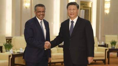 World Health Organization director general Tedros Adhanom (L) shakes hands with Chinese President Xi jinping before a meeting at the Great Hall of the People in Beijing on January 28, 2020. - China urged its citizens to postpone travel abroad as it expanded unprecedented efforts to contain a viral outbreak that has killed 106 people and left other governments racing to pull their nationals from the contagion's epicentre. (Photo by Naohiko Hatta / AFP) (Photo by NAOHIKO HATTA/AFP via Getty Images)