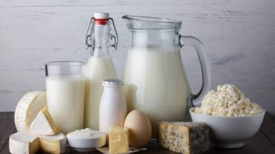 Dairy products on wooden table still life