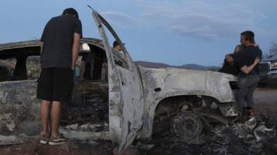 Adriana LeBaron (L), member of LeBaron family of the Mormon community based in northern Mexico, speaks next to Mexican senator Lilly Tellez during a meeting at the Senate in Mexico City, on December 3, 2019. - Three women and six children members of a Mormon community, who had dual US-Mexican citizenship, were killed in a hail of bullets last November 7 as they drove on a rural road between Sonora and Chihuahua, which border the United States. (Photo by Pedro PARDO / AFP)
