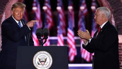 TOPSHOT - US President Donald Trump and US Vice President Mike Pence attend the third night of the Republican National Convention at Fort McHenry National Monument in Baltimore, Maryland, August 26, 2020. (Photo by SAUL LOEB / AFP)