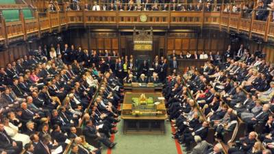 A handout photograph taken and released by the UK Parliament on March 29, 2019 shows Britain's Attorney General Geoffrey Cox stand and speak during a debate in the House of Commons on the Government's EU Withdrawal Agreement Bill. - British MPs on Friday rejected Prime Minister Theresa May's EU divorce deal for a third time, opening the way for a long delay to Brexit -- or a potentially catastophic 'no deal' withdrawal in two weeks. (Photo by MARK DUFFY / various sources / AFP) / EDITORS NOTE THE IMAGE HAS BEEN DIGITALLY ALTERED AT SOURCE TO OBSCURE VISIBLE DOCUMENTS - RESTRICTED TO EDITORIAL USE - NO USE FOR ENTERTAINMENT, SATIRICAL, ADVERTISING PURPOSES - MANDATORY CREDIT ' AFP PHOTO /Mark DUFFY/ UK Parliament'