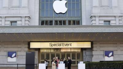 The apple logo is projected on a screen before the start of a product launch event at Apple's headquarters in Cupertino, California, on September 10, 2019. (Photo by Josh Edelson / AFP)