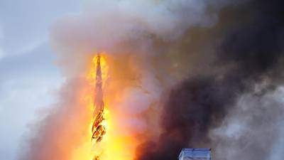 This photograph shows flames engulfing the Copenhagen's Stock Exchange building, in Copenhagen, on April 16, 2024. (Photo by Ida Marie Odgaard / Ritzau Scanpix / AFP) / Denmark OUT