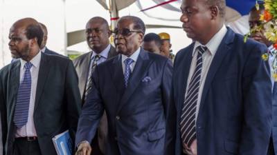 FILE PHOTO - Zimbabwe's President Robert Mugabe looks on during a rally marking Zimbabwe's 32nd independence anniversary celebrations in Harare, Zimbabwe April 18, 2012. REUTERS/Stringer/File Photo