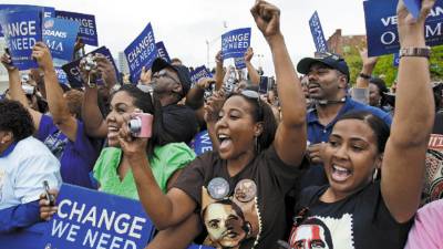 Supporters cheer at a campaign event for Democratic presidential candidate Sen. Barack Obama D-Ill., and vice presidential candidate Sen. Joe Biden, D-Del., in front of the J. Douglas Galyon Depot in Greensboro, N.C., Saturday, Sept. 27, 2008.(AP Photo/Alex Brandon)
