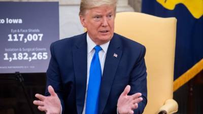 US President Donald Trump speaks about COVID-19 during a meeting with the Governor of Iowa in the Oval Office of the White House in Washington, DC, on May 6, 2020. (Photo by SAUL LOEB / AFP)