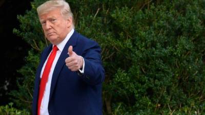 US President Donald Trump gestures as he arrives at the White House in Washington, DC, on October 3, 2019 after returning from an event in Florida. (Photo by Jim WATSON / AFP)