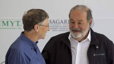 El estadounidense Bill Gates y el magnate Carlos Slim reunidos en un eventocelebrado en la capital mexicana el año pasado.