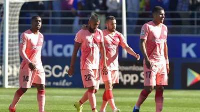 El Barcelona sin sus máximas figuras como ser Messi, Piqué, Luis Suárez, Rakitic, decepcionó al empatar 0-0 ante el Huesca, el club que marcha en el último lugar de la Liga. El partido estuvo marcado por el debut de varios jugadores en el club catalán y al final se excusaron de manera insólita. Fotos AFP.