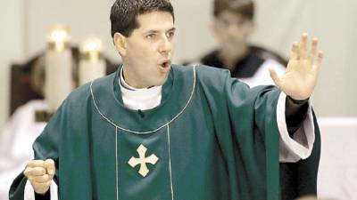 ** TO GO WITH PADRE ALBERTO ** FILE - In this Sunday, Oct. 3, 1999 file photo, Father Alberto Cutie speaks to his congregation during service, at St. Patrick's Church in Miami Beach, Fla. (AP Photo/Tony Gutierrez, file)