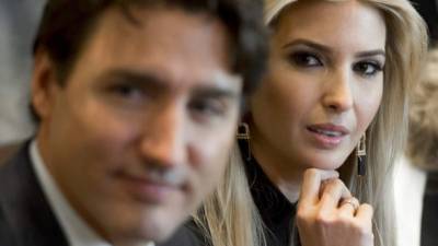 Canadian Prime Minister Justin Trudeau sits alongside Ivanka Trump (R), daughter of US President Donald Trump, during a roundtable discussion on women entrepreneurs and business leaders in the Cabinet Room of the White House in Washington, DC, February 13, 2017. / AFP PHOTO / SAUL LOEB