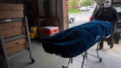 LOS ANGELES, CALIFORNIA - JUNE 25: Wendy Ibarra has her temperature checked before receiving her second vaccination dose, next to a sign promoting free amusement park tickets for those receiving their first dose, at a vaccination clinic in South Los Angeles on June 25, 2021 in Los Angeles, California. St. John's Well Child and Family Center is administering COVID-19 vaccines across South L.A. in a broad effort to bring vaccines to minority communities. Mario Tama/Getty Images/AFP (Photo by MARIO TAMA / GETTY IMAGES NORTH AMERICA / Getty Images via AFP)