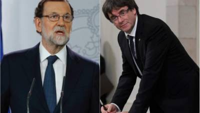 El presidente del Gobierno español, Mariano Rajoy y el presidente catalán Carles Puigdemont. Foto: EFE/AFP