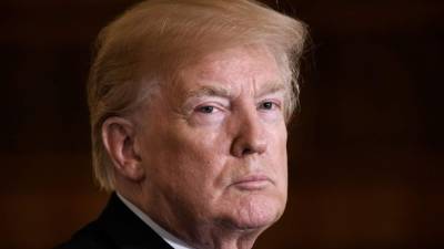 US President Donald Trump looks on during a joint press conference with President Raimonds Vejonis of Latvia, President Kersti Kaljulaid of Estonia and President Dalia Grybauskaite of Lithuania in the East Room of the White House on April 3, 2018 in Washington, DC. This year, the three Baltic States (Estonia, Latvia and Lithuania) celebrate their 100th year of independence. / AFP PHOTO / Olivier Douliery