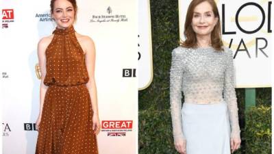 La actriz estadounidebnse Emma Stone y la intérprete francesa Isabelle Huppert