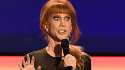 (FILES) This file photo taken on February 7, 2016 shows Host Kathy Griffin as she takes the stage at the AARP 15th Annual Movies For Grownups Awards at the Beverly Wilshire Hotel in Beverly Hills, California.Donald Trump castigated a well-known comedian on May 31, 2017after the release of a grisly-looking photo showing her holding up a prop depicting the president's bloodied severed head. Kathy Griffin had apologized earlier for the picture -- released on Tuesday by the celebrity photographer Tyler Shields -- following a wave of criticism from many quarters, saying in a video posted on Instagram that 'I beg for your forgiveness' for having 'crossed a line.' / AFP PHOTO / ROBYN BECK