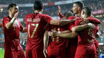 Los jugadores de Portugal celebrando uno de los goles contra Argelia. Foto AFP