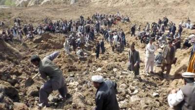 Afghan refugees arrive at Skopje International Airport, in Skopje on August 30, 2021, after being evacuated from Kabul following the Taliban takeover of Afghanistan. - A first group of 149 Afghan evacuees landed late August 30, 2021 in North Macedonia, where they will stay for a few months pending resettlement elsewhere. (Photo by Robert ATANASOVSKI / AFP)