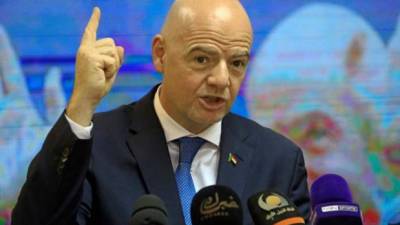 (FILES) In this file photograph taken on February 22, 2021, FIFA President Gianni Infantino gestures as he holds a press conference at the headquarters of Sudan Football Association in the Sudanese capital Khartoum. - FIFA president Gianni Infantino is expected to deliver his verdict on the European Super League on April 20, 2021, after the widely condemned breakaway competition triggered threats of legal action and punitive measures. European body UEFA will look to support from the world football chief at its congress in Switzerland as it attempts to quash an initiative that threatens its prized Champions League and the health of domestic competitions such as England's Premier League. (Photo by ASHRAF SHAZLY / AFP)