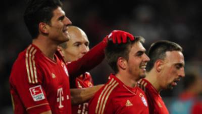 (LtoR) Munich's forward Mario Gomez, Dutch midfielder Arjen Robben, defender Philipp Lahm and French midfielder Franck Ribery celebrate after Gomez scored the goal to win the German first division Bundesliga football match between VfB Stuttgart and Bayern Muenchen at the Mercedes Benz Arena in Stuttgart, southern Germany, on December 11, 2011. AFP PHOTO THOMAS KIENZLERESTRICTIONS / EMBARGO - DFL LIMITS THE USE OF IMAGES ON THE INTERNET TO 15 PICTURES (NO VIDEO-LIKE SEQUENCES) DURING THE MATCH AND PROHIBITS MOBILE (MMS) USE DURING AND FURTHER TWO HOURS AFTER THE MATCH: FOR MORE INFORMATION CONTACT DFL.
