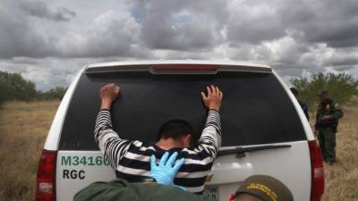 ROMA, TX - AUGUST 16: Detained immigrants are searched after being captured by U.S. Border Patrol agents on August 16, 2016 in Roma, Texas. Border security has become a main issue in the U.S. Presidential campaign, as Republican Presidential candidate Donald Trump has promised to build a wall, at Mexico's expense to fortify the U.S.-Mexico border. John Moore/Getty Images/AFP== FOR NEWSPAPERS, INTERNET, TELCOS & TELEVISION USE ONLY ==