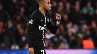 Paris Saint-Germain's French forward Kylian Mbappe reacts at the end of during the UEFA Champions League round of 16 second-leg football match between Paris Saint-Germain (PSG) and Manchester United at the Parc des Princes stadium in Paris on March 6, 2019. (Photo by FRANCK FIFE / AFP)