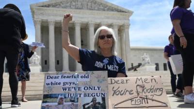 (FILES) In this file photo taken on May 31, 2019, Pro-choice supporters and staff of Planned Parenthood hold a rally outside the Planned Parenthood Reproductive Health Services Center in St. Louis, Missouri. - The Missouri state health department on June 21, 2019, denied a license to the only abortion clinic in the midwestern US state, but it will remain open pending a court ruling. The denial of the license was announced by Planned Parenthood, which operates the abortion clinic in the city of St. Louis. 'Missouri's health department weaponized a regulatory process to deny an abortion license to the last remaining health center in Missouri that provides abortion,' Planned Parenthood said in a tweet. (Photo by SAUL LOEB / AFP)