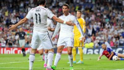 Cristiano Ronaldo marcó un gol ante el Basilea. Acá celebra con Gareth Bale.