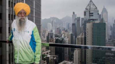 Indian-born British national Fauja Singh looks on during a press conference in Hong Kong on February 21, 2013. The 101-year-old Sikh regarded as the world's oldest marathon runner said he was 'hurt' over his retirement plan as he feared people will forget him, ahead of his last race to take place in Hong Kong on February 24. AFP PHOTO / Philippe Lopez