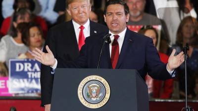 Fotografía de archivo del gobernador de Florida y el expresidente de EE.UU., Donald J. Trump.