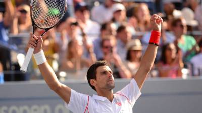 Serbia's tennis player Novak Djokovic reacts after winning against Russia's tennis player Daniil Medvedev during the Davis Cup World Group first round singles tennis match between Serbia and Russia at Cair sports hall in Nis, on February 3, 2017.At Nis, 12-time major winner Novak Djokovic, just one of two of the world's top 15 who are playing in the first round this weekend, was taking on 20-year-old Daniil Medvedev as 2010 champions Serbia took on Russia. / AFP PHOTO / ANDREJ ISAKOVIC