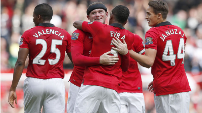 Manchester United's Portuguese striker Cristiano Ronaldo (R) celebrates with teammates after scoring the opening goal of the English Premier League football match between Manchester United and Newcastle at Old Trafford in Manchester, north west England, on September 11, 2021. (Photo by Oli SCARFF / AFP) / RESTRICTED TO EDITORIAL USE. No use with unauthorized audio, video, data, fixture lists, club/league logos or 'live' services. Online in-match use limited to 120 images. An additional 40 images may be used in extra time. No video emulation. Social media in-match use limited to 120 images. An additional 40 images may be used in extra time. No use in betting publications, games or single club/league/player publications. /