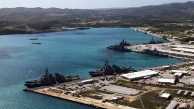 This image obtained from the US Department of Defense shows the US Naval Base Guam at Apra Harbor on March 5, 2016.The United States on August 9, 2017, warned North Korea that the pursuit of its nuclear drive could lead to the collapse of Kim Jong-Un's regime, as US President Donald Trump brandished America's nuclear might as a powerful deterrent. North Korea said that it is considering strikes near US installations in Guam with its intermediate range ballistic missiles, state news agency KCNA reported. / AFP PHOTO / US NAVY / Jeff Landis / RESTRICTED TO EDITORIAL USE - MANDATORY CREDIT 'AFP PHOTO / US NAVY / Jeff Landis, Major, USMC (Ret.), Director of Public Affairs/Communications' - NO MARKETING NO ADVERTISING CAMPAIGNS - DISTRIBUTED AS A SERVICE TO CLIENTS
